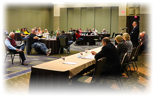 Board members sitting at the table during the annual meeting