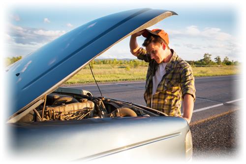 Man checking under the hood of a car