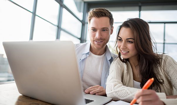 Man and woman looking at laptop
