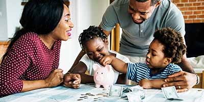 family over piggy bank