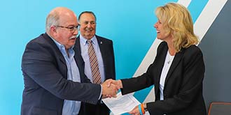 Man and woman shaking hands. Blue, white and gray angled background ES