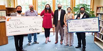 Credit union members at a check presentation