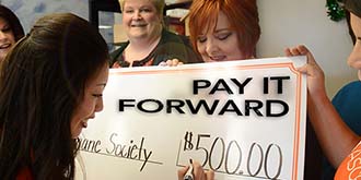 Ascentra pays it forward with five hundred dollar check.