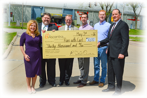 Ascentra presents thirty thousand dollars to Run with Carl