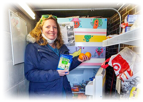 Ascentra employee holding up her donation to the Minnie Fridge