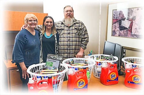 Steppin Up with Random Acts of Kindness Team Ascentra makes a donation to the Muskie Locker