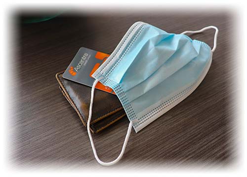 Ascentra credit card sitting under a mask on a desk