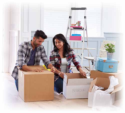 woman and man filling packing boxes