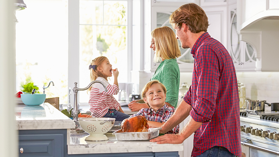 Happy family cooking dinner