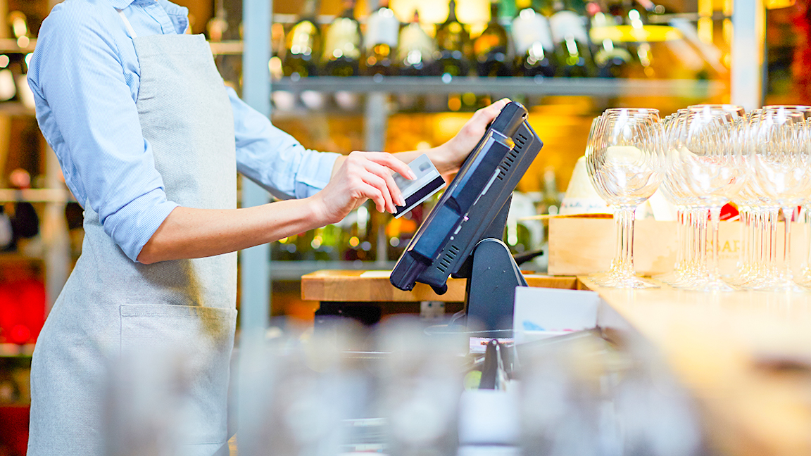 Waiter using a point of sale terminal