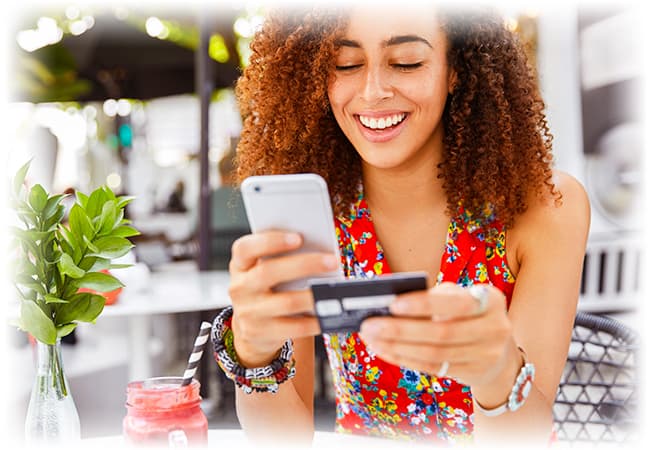 Woman putting card number in phone