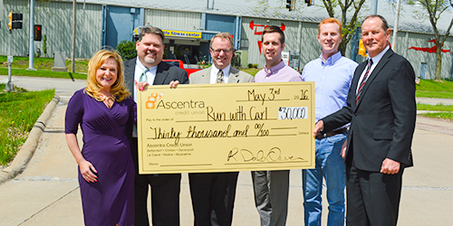 Thirty-thousand dollar check presentation to Run with Carl.