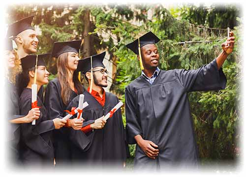 graduate taking selfie with 5 other graduates