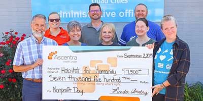 Ascentra Credit union presents a donation to Habitat for Humanity of the Quad Cities