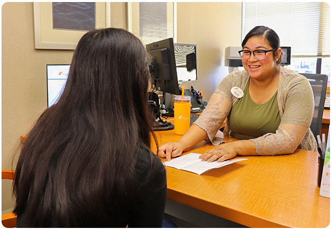 An Ascentra Financial Coach helping a member