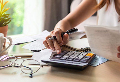 A person using a calculator