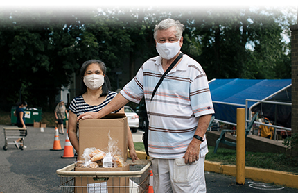 Senior citizens picking up food from foodbank